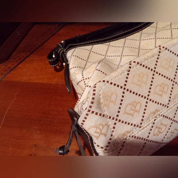 Dooney and Bourke East West Slouch canvas signature fabric. Cream and brown. - Picture 15 of 16